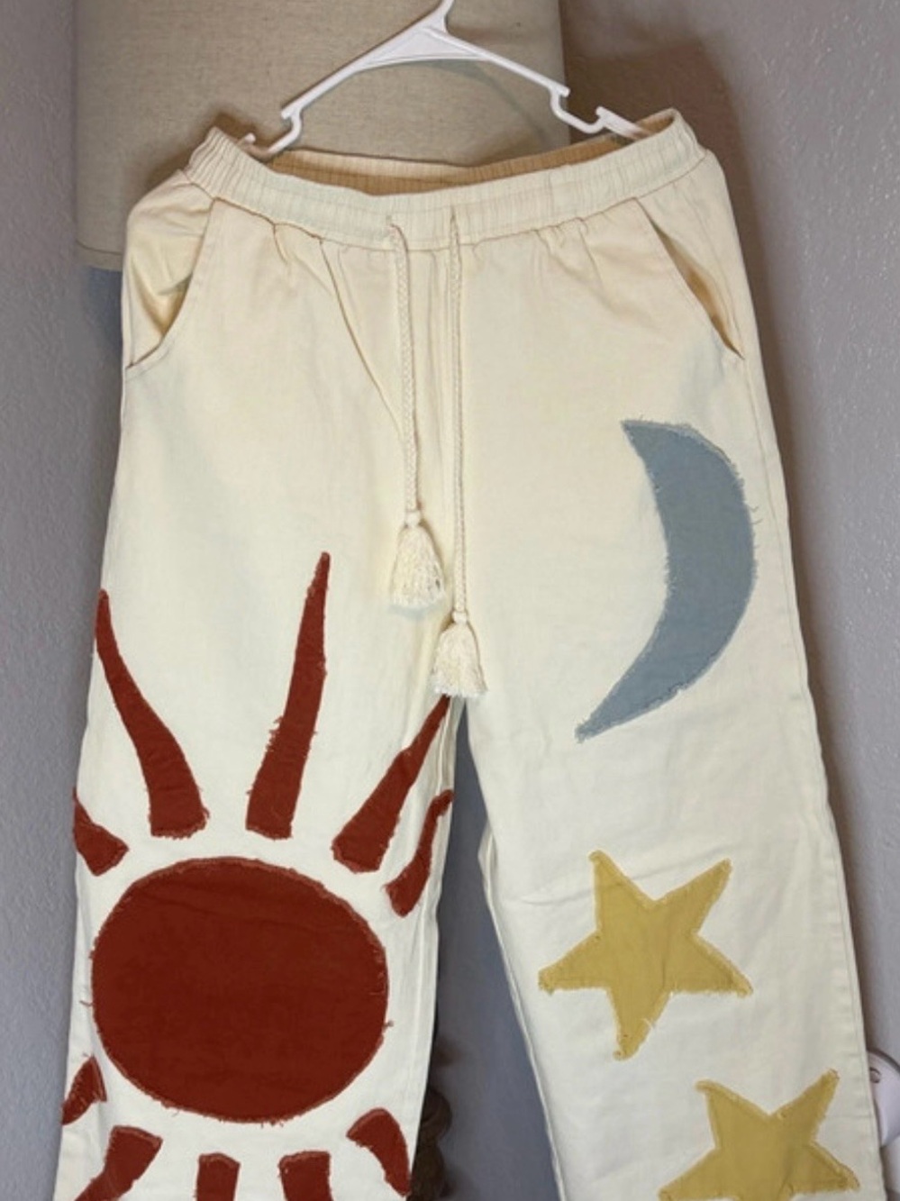 NWOT Mello Brand Wide Leg Cream Drawstring Pants with Sun, Moon & Star Appliqués